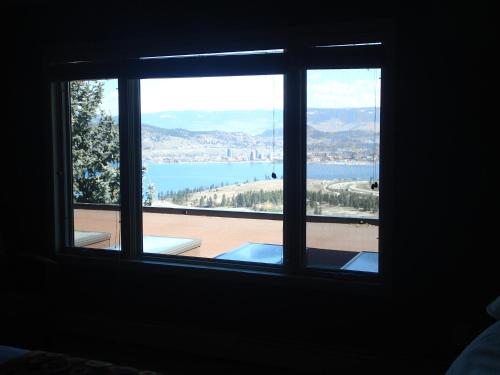 a window with a view of a body of water at A View of the Lake B & B in West Kelowna