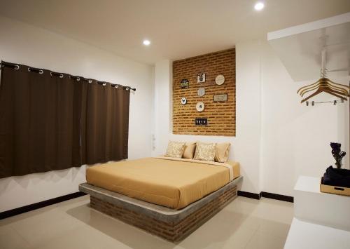 Postel nebo postele na pokoji v ubytování The Sun resort Ratchaburi