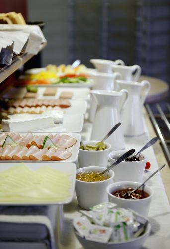 a buffet line with many different types of food at Good Morning Karlstad City in Karlstad