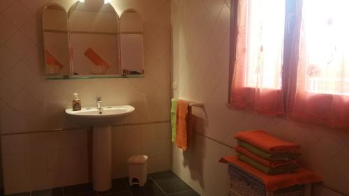 a bathroom with a sink and a mirror at Il Sogno di Alghero - Adults Only in Alghero
