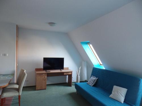 Μια τηλεόραση ή/και κέντρο ψυχαγωγίας στο Apartamenty Twoje Mikołajki