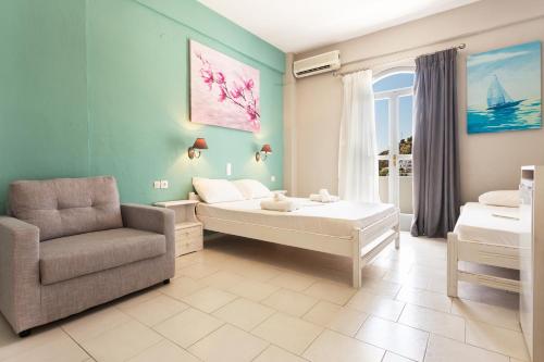 
a living room filled with furniture and a painting at Protopapas Rooms in Loutro
