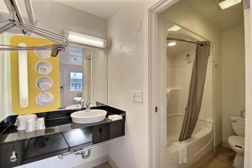 a bathroom with a sink and a toilet and a shower at Motel 6-San Marcos, TX in San Marcos