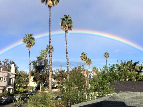 a rainbow in the sky with palm trees at Double Suite Santa Monica - Free Parking in Santa Monica