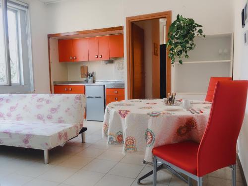 a kitchen with a table and a chair and a table and a table at VeniceApartment公寓 in Mestre