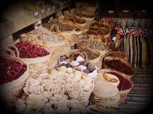 a display of different types of food in baskets at Ali Baba Hotel in Dahab