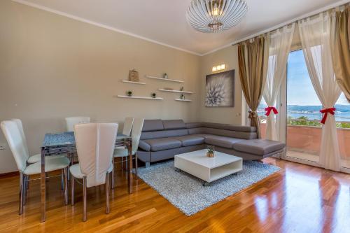 a living room with a couch and a table at Villa Nada in Lovran