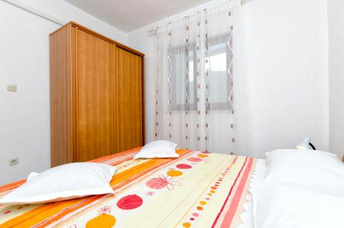 Postel nebo postele na pokoji v ubytování Apartments Mime