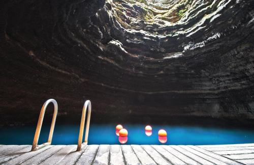 a group of candles sitting on a dock near the water at Homestead Resort in Midway