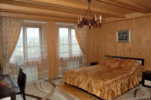 A bed or beds in a room at U Olgi