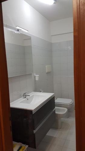 a bathroom with a sink and a toilet at Casa Nadia in Perugia