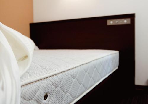 Ένα ή περισσότερα κρεβάτια σε δωμάτιο στο AB Hotel Nara