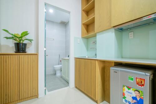 a bathroom with a toilet and a sink at Babylon D3 Serviced Apartment in Ho Chi Minh City