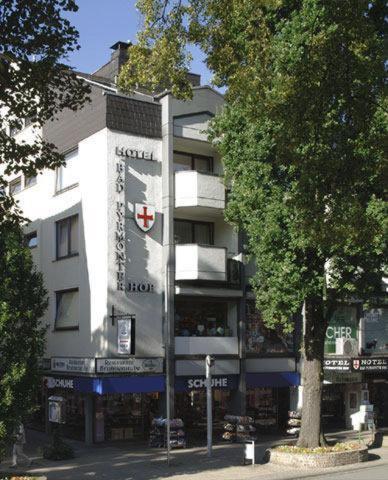 a building with a sign on the side of it at Bad Pyrmonter Hof in Bad Pyrmont