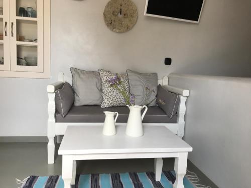 a living room with a couch and a table at Spitaki Serifos Studio in Rámos