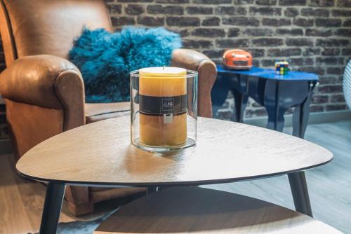 a candle sitting on top of a table at Gite "le millésime" in Épernay