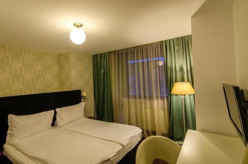Apart Hotel Vlad Tepesにあるベッド