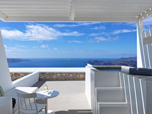 a balcony with a view of the ocean at Lilium Hotel Santorini in Fira