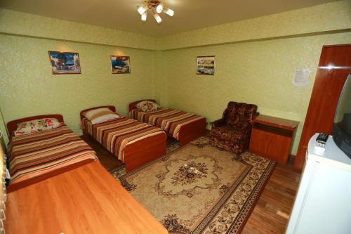 Ein Bett oder Betten in einem Zimmer der Unterkunft Guest House Ekaterina
