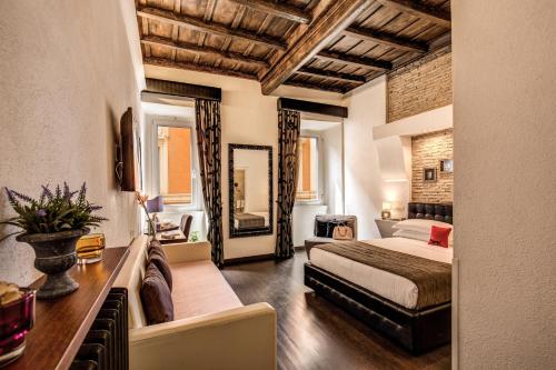 a bedroom with a bed and a mirror at Tritone Top House in Rome