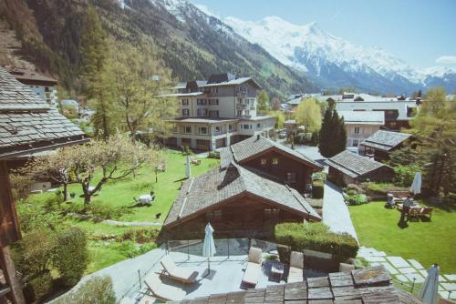 a view of a village with mountains in the background at Le Hameau Albert 1er in Chamonix