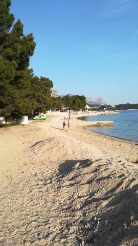 a group of people walking on the beach at The best location in Makarska,free P, option bikes in Makarska