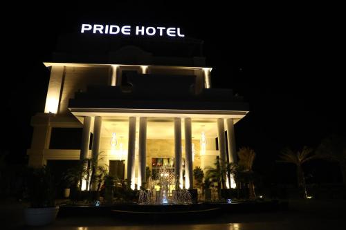 a hotel at night with a lit up building at Pride Hotel & Convention Centre Indore in Indore