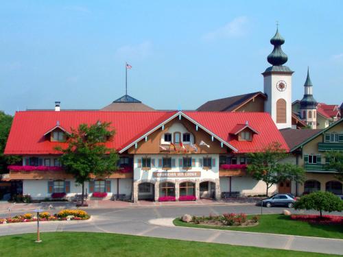a building with a red roof and a clock tower at Bavarian Inn Lodge in Frankenmuth