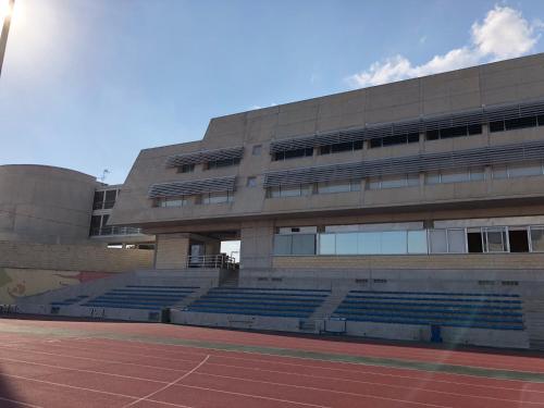 a large building with a basketball court in the middle of it at Allegra GSP Sport Center in Nicosia