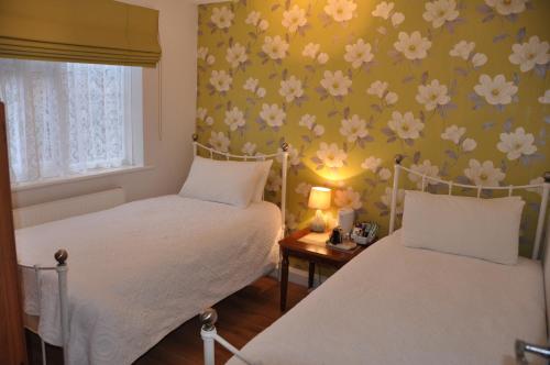Una cama o camas en una habitación de Walcot House