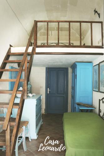 a bedroom with a bunk bed with a ladder at Casa Leonardo in Favignana