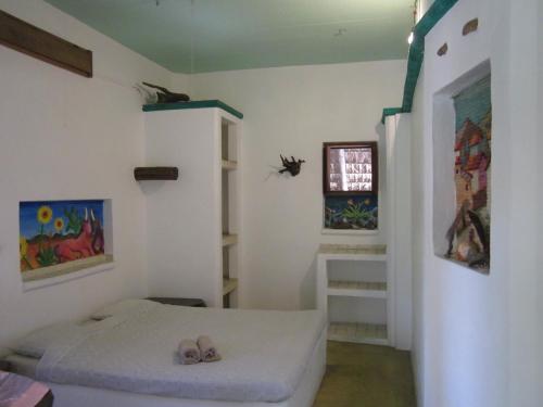 Una cama o camas en una habitación de Castillo Oasis