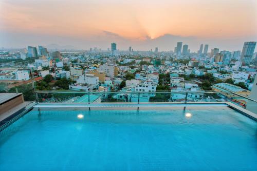 a swimming pool with a view of the city at Ocean Haven Hotel in Da Nang