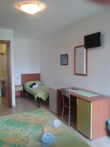 Ένα ή περισσότερα κρεβάτια σε δωμάτιο στο Guesthouse Affittacamere Goloritzè