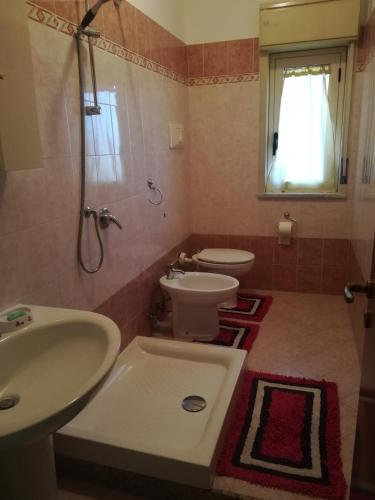 a bathroom with a sink and a toilet and a shower at B&B Il Gabbiano in Reggio Calabria