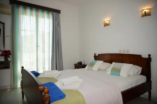 Ένα ή περισσότερα κρεβάτια σε δωμάτιο στο Adonis Hotel Naxos