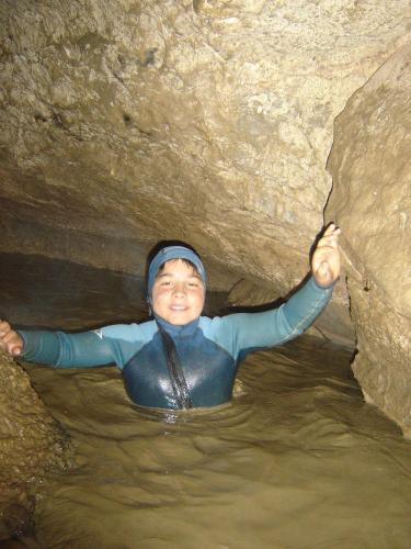 a person in the water in a cave at Pinarillos in Sarvisé