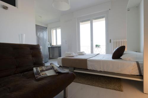 A bed or beds in a room at Little House With Lake View