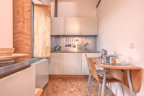 a kitchen with a table and chairs in a room at Casale del Mare in Castiglioncello