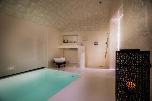 a bathroom with a tub and a shower in a room at Villa Pauletta in Split