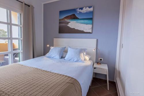 A bed or beds in a room at Ocean view La Quinta