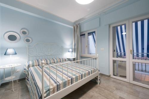 Ένα ή περισσότερα κρεβάτια σε δωμάτιο στο Casa Vacanze Anfitrite