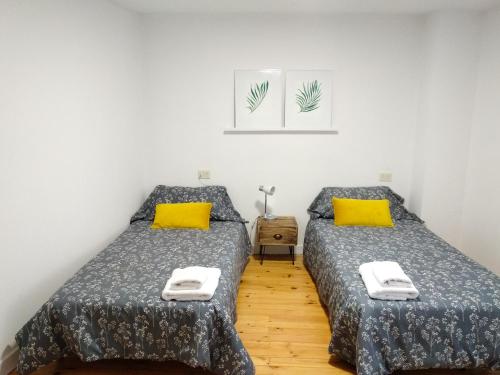 Posteľ alebo postele v izbe v ubytovaní As Casiñas