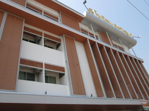 a building with orange shutters on it at The Ocean Residence in Nakhon Ratchasima