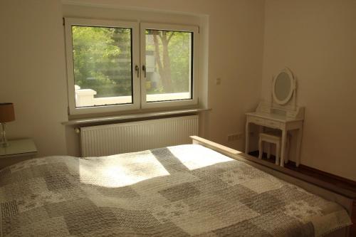 En eller flere senge i et værelse på holidayhome Heidelberg
