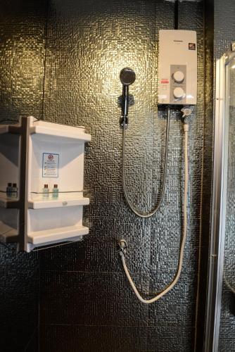 a shower in a bathroom with a shower at DB Plus 3 in Bangkok