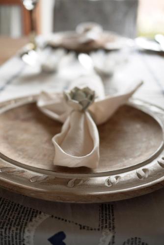 a plate with a bow on top of a table at A Hilltop Country Retreat in Swellendam