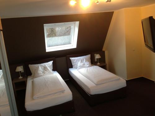 Postel nebo postele na pokoji v ubytování Hotel Destination 21