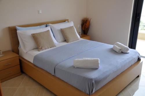 Ένα ή περισσότερα κρεβάτια σε δωμάτιο στο Belvedere Hotel & Suites