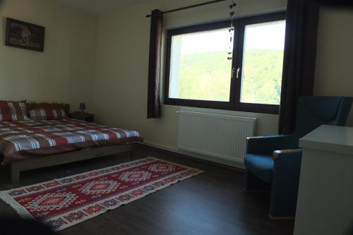 En eller flere senger på et rom på Szejke Villa